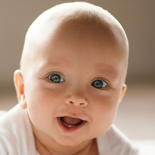 smiling infant at a Preschool & Daycare Serving Milton, DE, Frederica, DE, Harrington, DE, Dover, DE, Baltimore, MD