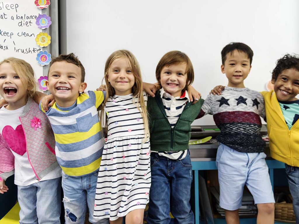 group of preschoolers smiling together