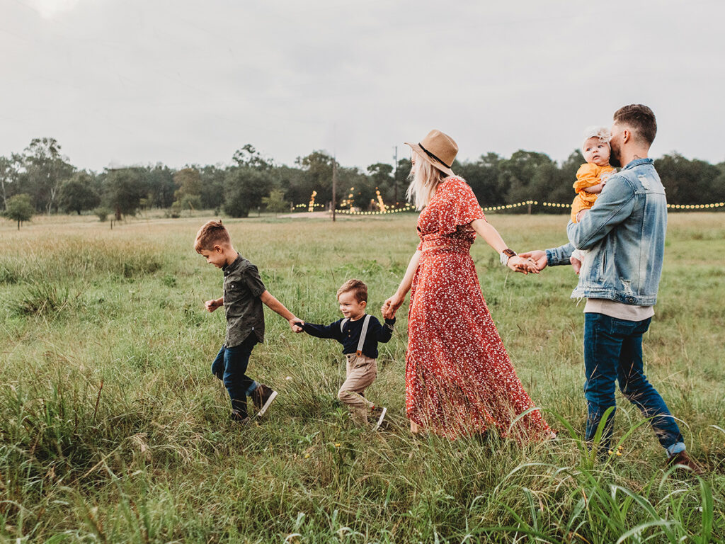 picture of family walking through a field